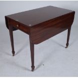 A LATE GEORGE III MAHOGANY PEMBROKE TABLE