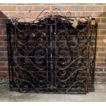 A SET OF THREE WROUGHT IRON GARDEN GATES WITH SCROLLING DECORATION