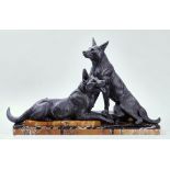 AN ART DECO SPELTER AND MARBLE MOUNTED SCULPTURE OF TWO GERMAN SHEPHERDS