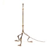 AN ARTS AND CRAFTS STYLE LACQUERED BRASS FLOOR STANDING LIGHT