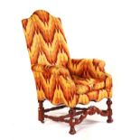 A 17TH CENTURY STYLE WALNUT FRAMED HIGH-BACK EASY ARMCHAIR