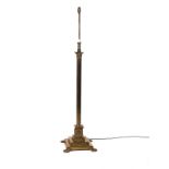 A GILT LACQUERED BRASS ADJUSTABLE CORINTHIAN COLUMN FLOOR STANDING LIGHT