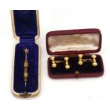 A PAIR OF 18CT GOLD CUFFLINKS AND A GOLD AND SEED PEARL STICK PIN (3)