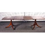 A REGENCY STYLE MAHOGANY PEDESTAL EXTENDING DINING TABLE