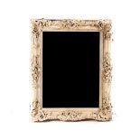 A LOUIS XV STYLE WHITE PAINTED COMPOSITION PICTURE FRAME MIRROR