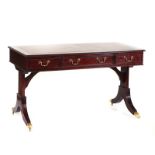 A GEORGE III STYLE RECTANGULAR THREE DRAWER WRITING TABLE