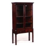 A GEORGE III MAHOGANY DISPLAY CABINET ON STAND