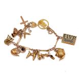 A 9CT GOLD CHARM BRACELET