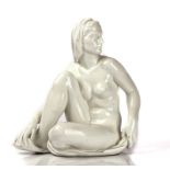 A MEISSEN WHITE GLAZED FIGURE OF A SEATED NUDE GAZING