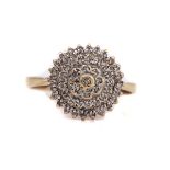 A 9CT GOLD AND DIAMOND CLUSTER RING