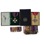 A GROUP OF ELEVEN DECORATIONS AND MEDALS AS AWARDED TO C M R SCHWERDT ROYAL NAVY