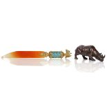 A CARVED BOULDER OPAL MODEL OF A RHINOCEROS AND A RUSSIAN STYLE AGATE LETTER OPENER (2)