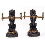 A PAIR OF VICTORIAN CAST IRON AND BRASS FIRE DOGS / TOOL RESTS