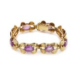 A GOLD AND AMETHYST BRACELET