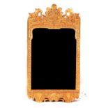 A GEORGE II GILT FRAMED MIRROR