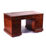 A LATE VICTORIAN MAHOGANY KNEE-HOLE DESK