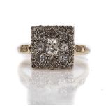 A 9CT WHITE GOLD AND DIAMOND SQUARE CLUSTER RING