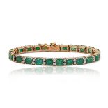 A GOLD, EMERALD AND DIAMOND BRACELET