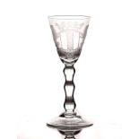 A DUTCH ENGRAVED ARMORIAL WINE GLASS