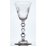 A DUTCH ENGRAVED ARMORIAL LIGHT BALUSTER WINE GLASS