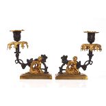 A PAIR OF EARLY VICTORIAN PARCEL-GILT AND BRONZE PATINATED CANDLESTICKS