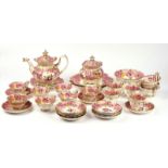 A COALPORT PINK-GROUND PART TEA AND COFFEE SERVICE