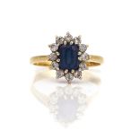 AN 18CT GOLD, SAPPHIRE AND DIAMOND OVAL CLUSTER RING