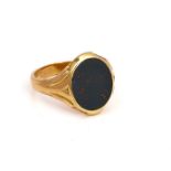 A GOLD AND BLOODSTONE OVAL SIGNET RING