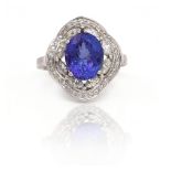 A WHITE GOLD, TANZANITE AND DIAMOND CLUSTER RING