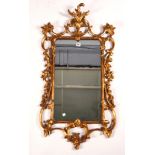 A GEORGE III STYLE GILT FRAMED MIRROR