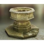 A RECONSTITUTED STONE GOTHIC REVIVAL OCTAGONAL FONT/PLANTER