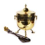 A LACQUERED BRASS COAL BUCKET AND FIRE TOOLS