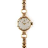 A TISSOT 9CT GOLD LADY'S BRACELET WRISTWATCH