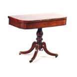 A REGENCY ROSEWOOD AND SIMULATED ROSEWOOD TEA TABLE