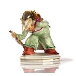 A MEISSEN FIGURE OF A CHINAMAN WITH MASK