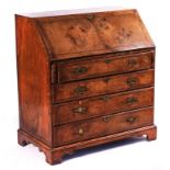 A MID-18TH CENTURY FEATHER-BANDED WALNUT BUREAU