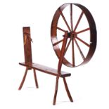 A 19TH CENTURY OAK AND ELM SPINNING WHEEL