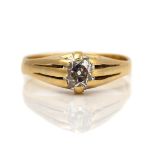 A GOLD AND DIAMOND SINGLE STONE RING