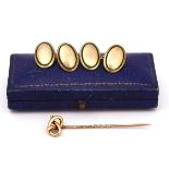 A PAIR OF GOLD AND ENAMELLED CUFFLINKS AND A STICK PIN (2)