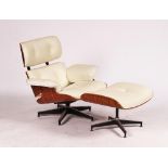 AFTER CHARLES AND RAY EAMES; A WALNUT AND CREAM LEATHER UPHOLSTERED LOUNGE CHAIR (2)