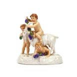 A COPENHAGEN PORCELAIN GROUP OF THREE PUTTO WITH A GOAT