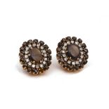 A PAIR OF GOLD CABOCHON BLACK SAPPHIRE AND DIAMOND EARCLIPS