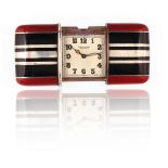A MOVADO SILVER AND ENAMELED RECTANGULAR FOLDING WATCH