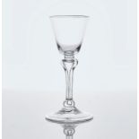 A PLAIN STEMMED WINE GLASS