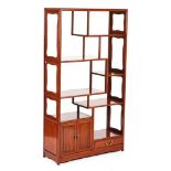 A 20TH CENTURY CHINESE HARDWOOD MULTI-TIERED DISPLAY CABINET