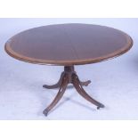 A GEORGE III POLLARD OAK BANDED CIRCULAR SNAP TOP BREAKFAST TABLE