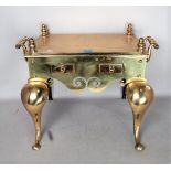 A VICTORIAN BRASS TRIVET FOOTMAN