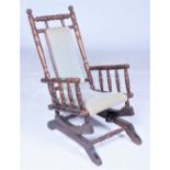 A 19TH CENTURY STYLE AMERICAN CHILD'S ROCKING ARMCHAIR