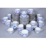 A LATE 19TH CENTURY BLUE AND WHITE PART DINNER AND TEA SERVICE DECORATED WITH BIRDS AND PALM...