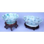 ASIAN CERAMICS; TWO EARLY 20TH CENTURY CHINESE CELADON GLAZED BOWLS ON HARDWOOD STANDS (2)